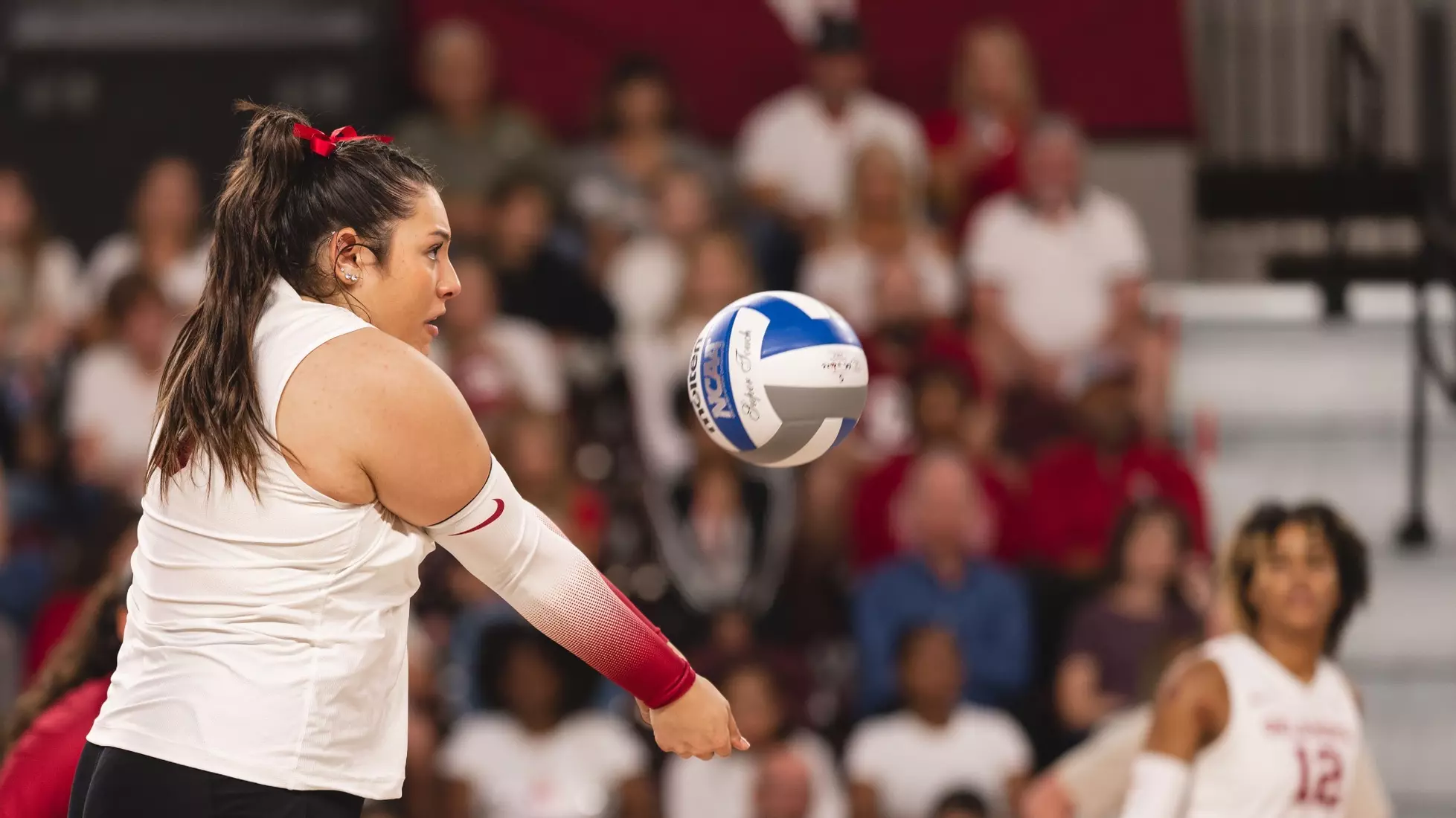Mele passing a hard driven ball at the University of Oklahoma in 2023